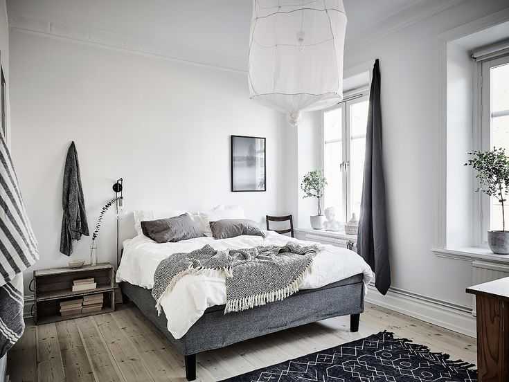 Спальня в скандинавском стиле: фото интерьера спальной комнаты с белой кроватью и шкафом